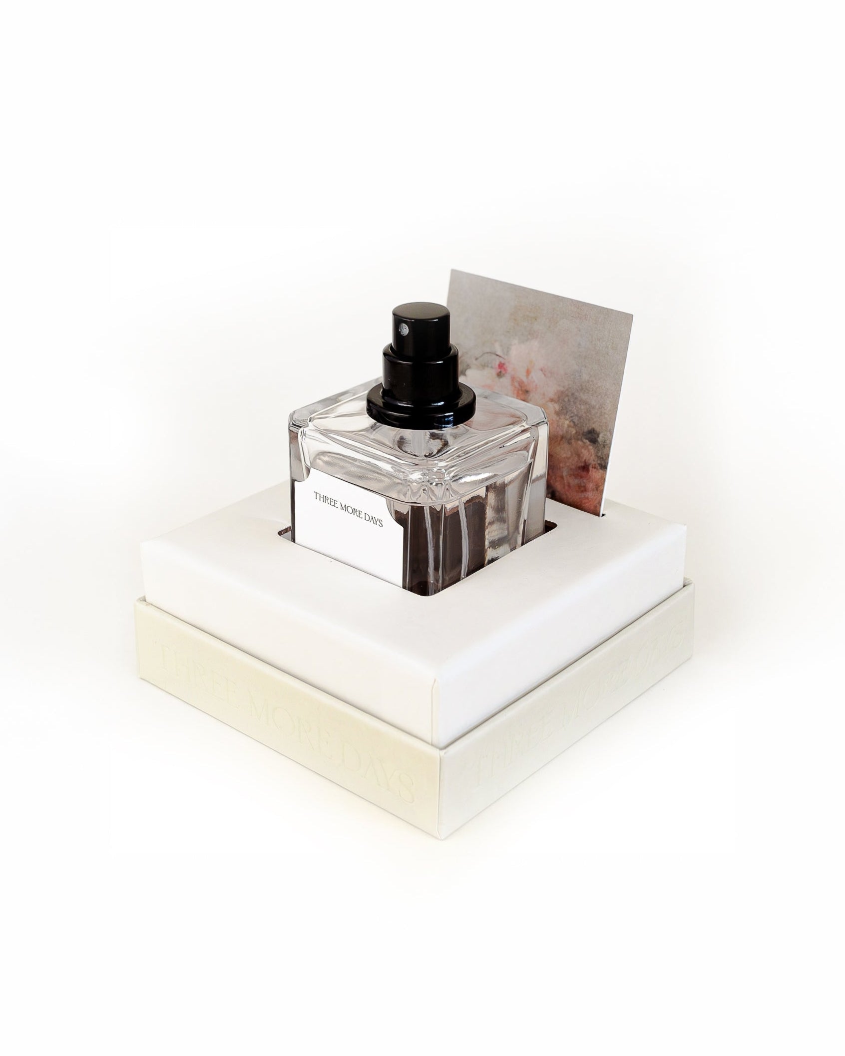 Perfume bottle on a white platform with a white background