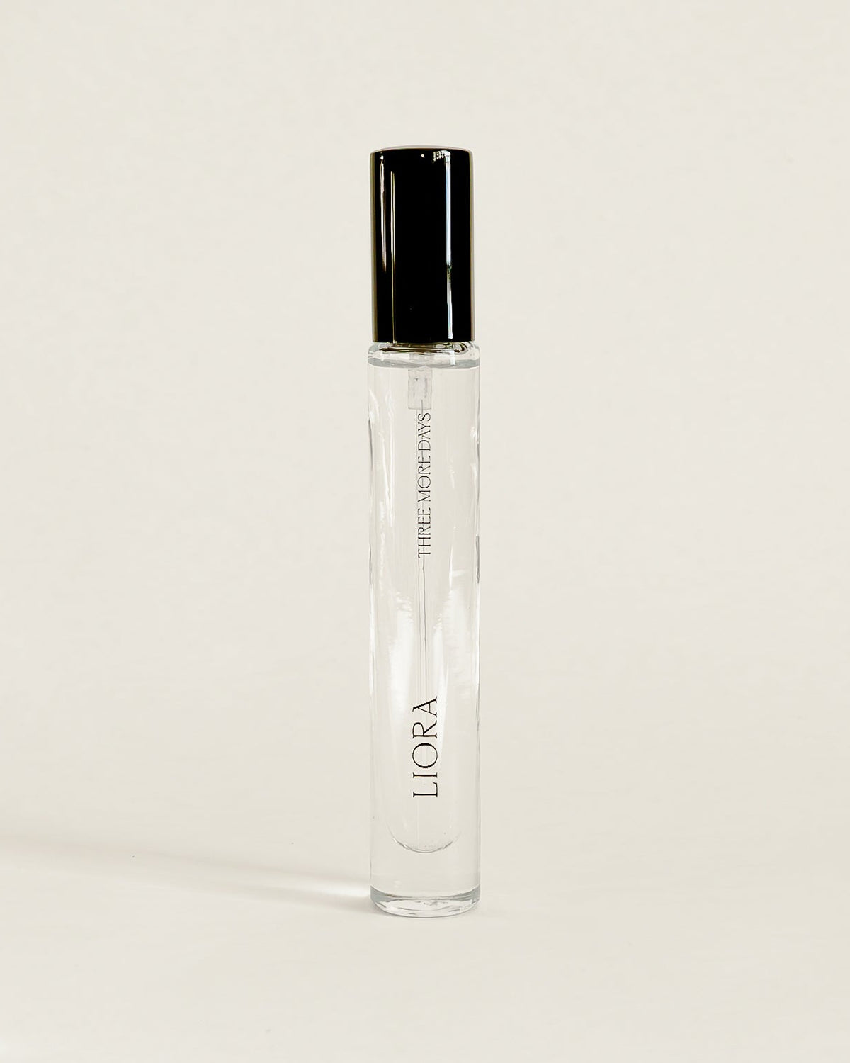 A clear glass perfume roller bottle with a black cap, standing upright on a white surface. The brand name 'LUOSA' is printed vertically on the bottle.