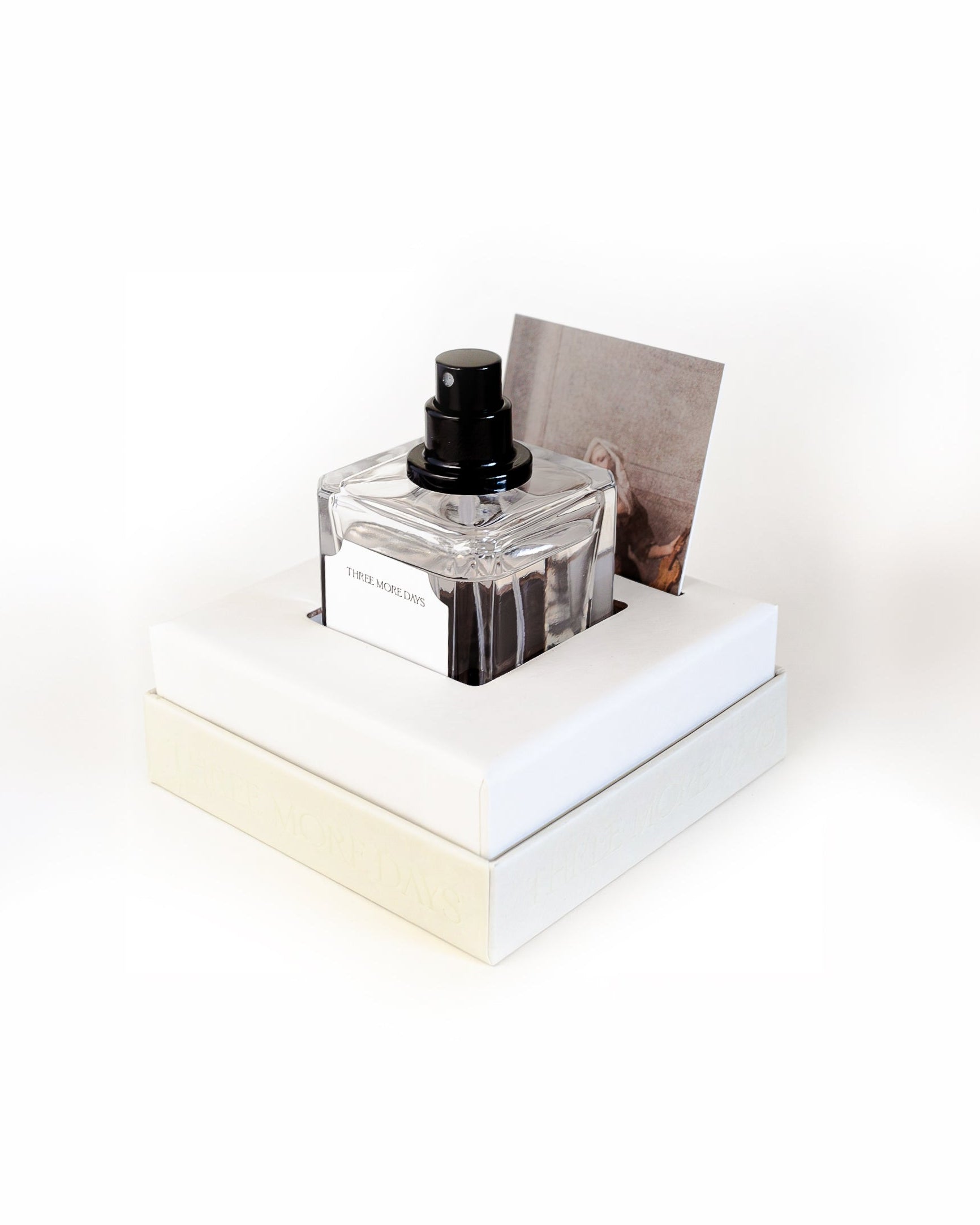 Ink bottle on a white stand with a white background